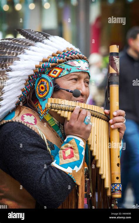 A street performer playing traditional peruvian pan pipes Stock Photo - Alamy