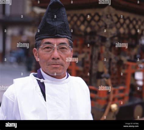 Shinto priest with mikoshi at Okkawa Festival Stock Photo - Alamy