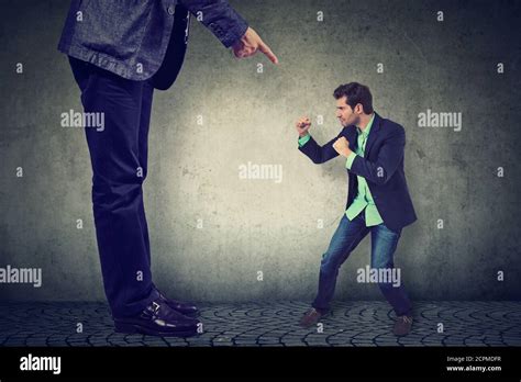 Big man little man fight hi-res stock photography and images - Alamy