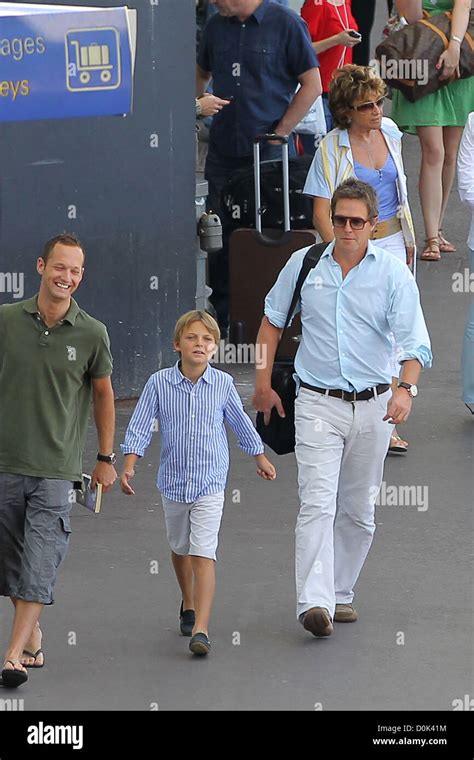 Hugh Grant is met at Nice airport by Damian Hurley, son of his ex girlfriend Elizabeth Nice ...