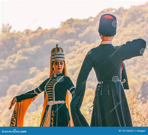 A Guy With A Girl In Traditional Circassian Clothes Dancing At The ...