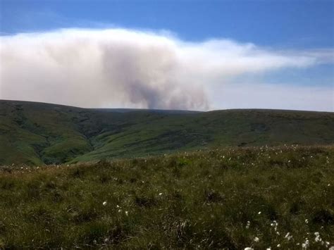 Warm weather reignites wildfires across Saddleworth Moor