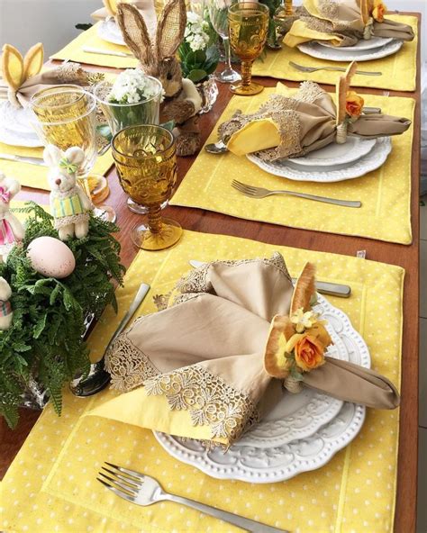 the table is set for easter dinner with yellow napkins