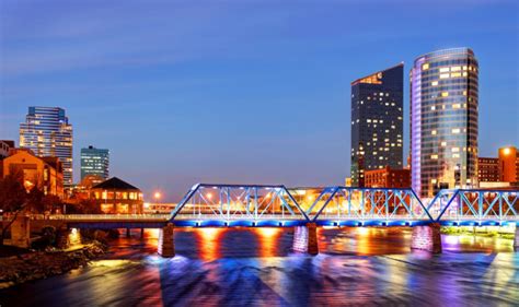 Grand Rapids Michigan skyline along the banks of the Grand river - Bold ...