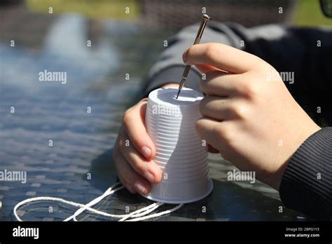 Making a telephone from plastic cups and string, science experiment with sound waves and ...