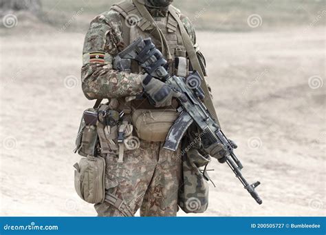 Soldier with Assault Rifle and Flag of Uganda on Military Uniform ...