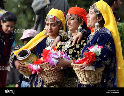 Women pose for kashmiri dress picture at nishat mughal garden, on the outskirts of Srinagar on ...