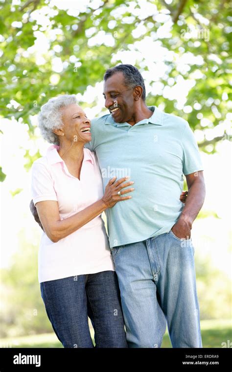 Romantic Senior African American Couple Walking In Park Stock Photo - Alamy