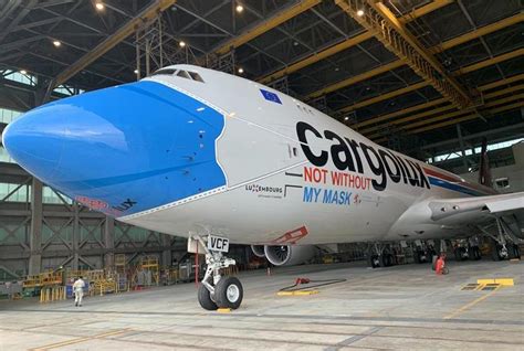 Cargolux has updated the livery of one of its Boeing 747-8 freighters to include a surgical mask ...