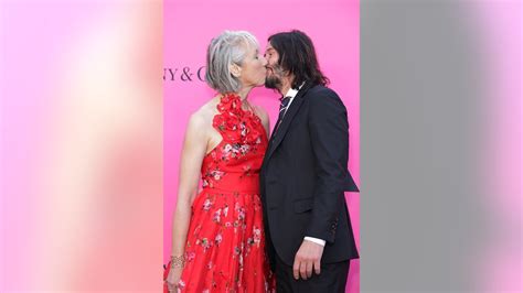 Keanu Reeves turns heads on red carpet as star kisses girlfriend Alexandra Grant with eyes wide ...