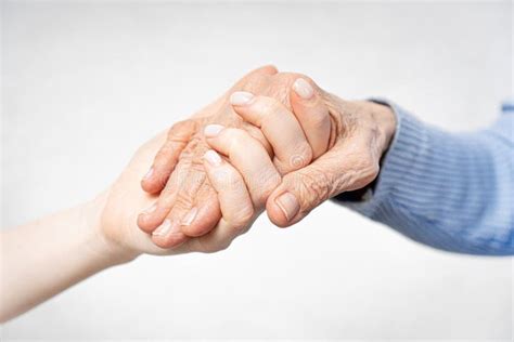 Young Hands Holding Old Hands. Stock Image - Image of pension, love: 179804519