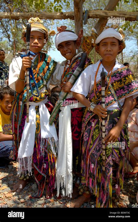 TIMOR LESTE Boys wearing traditional dress including ikat weaves and ...