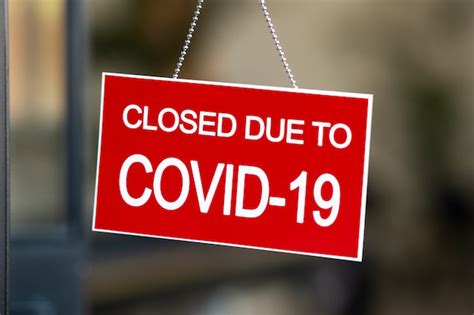 Premium Photo | Closed sign hanging on door of cafe due to covid-19