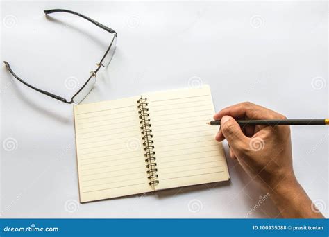 The man is writing a book. stock photo. Image of pencils - 100935088