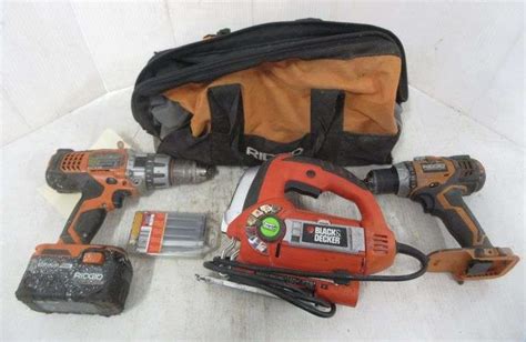 Ridgid tool bag, (2) Ridgid 18V drills, Ridgid battery, and Black ...