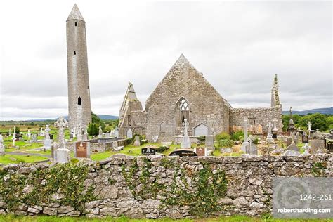 Ruins of Kilmacduagh Monastery with round tower, County Galway, Connacht, Republic of Ireland ...