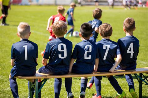 Boys on the bench - youth soccer players • SoccerToday