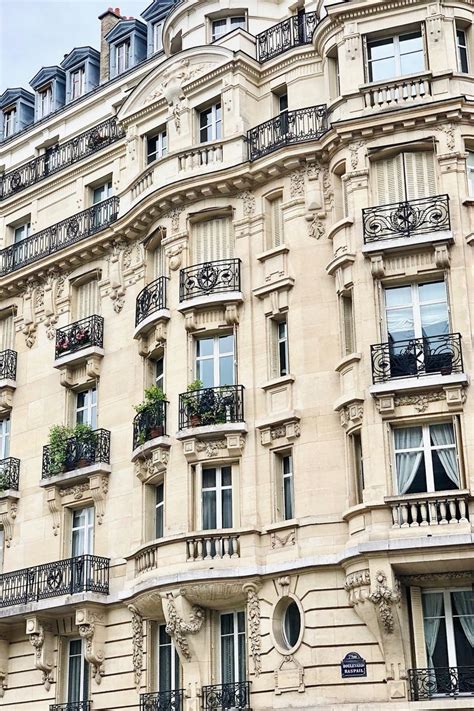 an old building with balconies and windows on the top floor is seen in ...