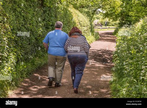 Overweight middle aged couple on a country walk. England, UK Stock Photo - Alamy