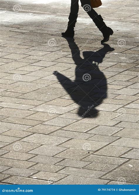 Shadow of man walking stock photo. Image of street, shadow - 79174774