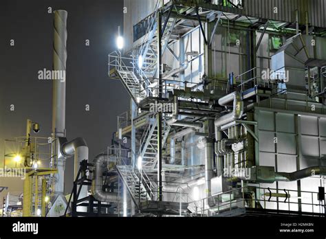 Industrial complex at night Stock Photo - Alamy