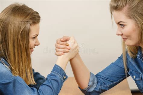 Two Women Having Arm Wrestling Fight Stock Photo - Image of angry, competing: 115393338