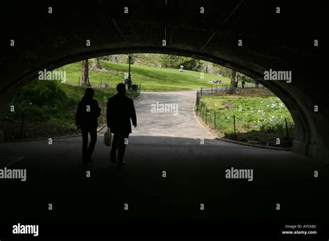 Two people walking in central park, New York City Stock Photo - Alamy