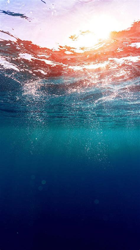 Download Underneath Ocean Surface Phone Wallpaper | Wallpapers.com