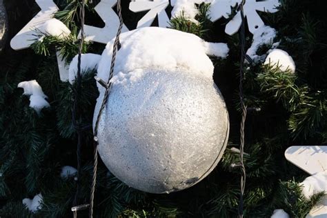 Premium Photo | White ball on a street christmas tree