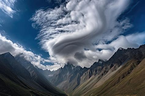 Premium AI Image | Majestic mountains with clouds swirling around the peaks created with ...