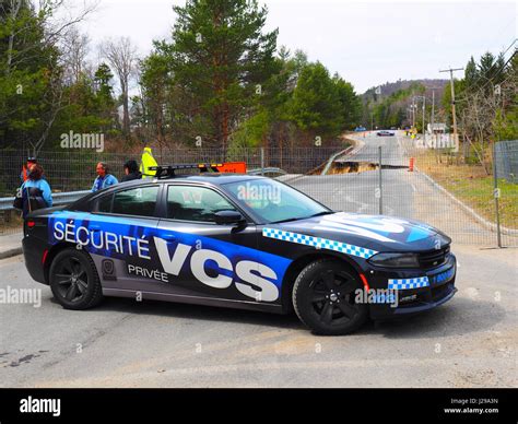 A private security car blocks off a street Stock Photo - Alamy