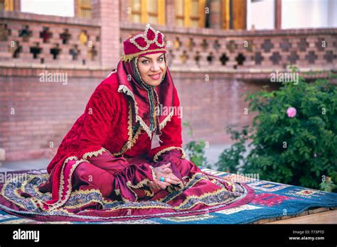 Iranian woman in red traditional dress Stock Photo - Alamy