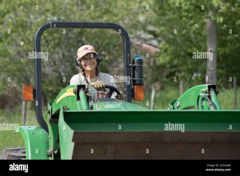 Woman driving tractor hi-res stock photography and images - Alamy