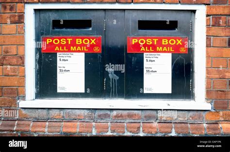 Royal mail post boxes outside a uk post office Stock Photo - Alamy