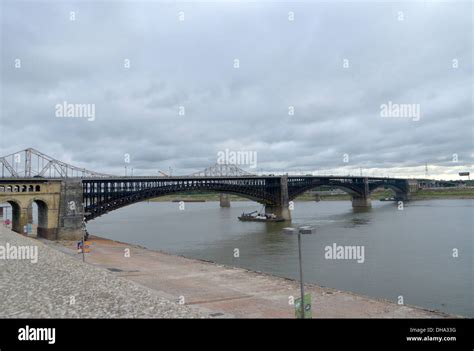 The Eads Bridge crosses the Mississippi river in St Louis, adjacent to the St Louis Arch ...