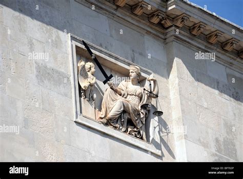 Scales of justice above the entrance to Lewes Crown Court on Lewes High Street Stock Photo - Alamy