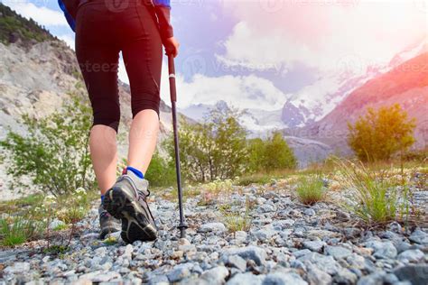 Nordic walking in the high mountains 8885494 Stock Photo at Vecteezy