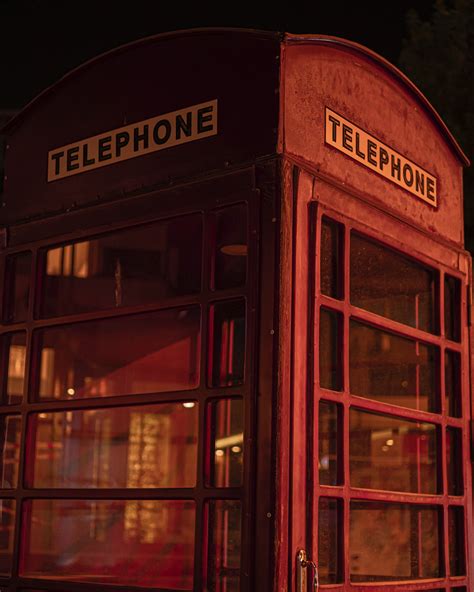 Clothes near Pink Telephone Booth · Free Stock Photo