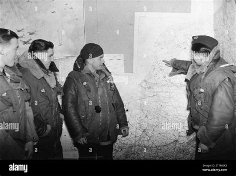 RAF Bomber Command 1940 A Wellington bomber crew studies a wall-mounted map, 13 December 1940 ...