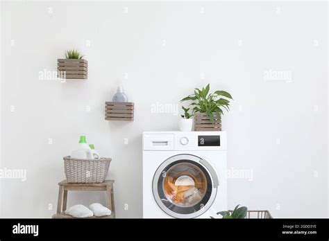 Interior of bathroom with modern washing machine Stock Photo - Alamy