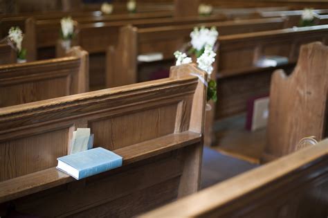 Wooden pews and a bible Creative Commons Stock Image