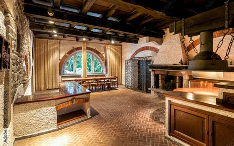 Interior of an old tavern with rustic brick fireplace Stock Photo | Adobe Stock