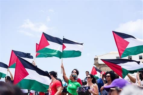 Premium Photo | Protesters are holding a palestinian flag during a ...