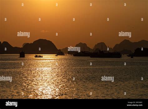 Sunset in the Ha Long Bay of Vietnam Stock Photo - Alamy