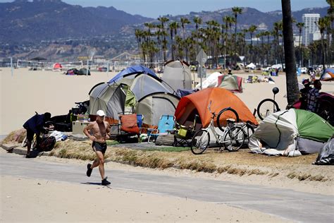 Los Angeles passes measure limiting homeless encampments | AP News