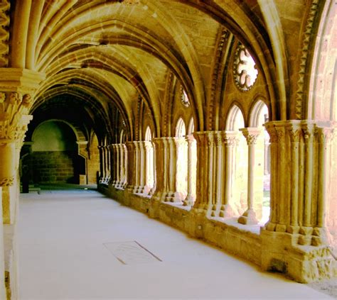 an old building with arched windows and stone arches on the ceiling ...