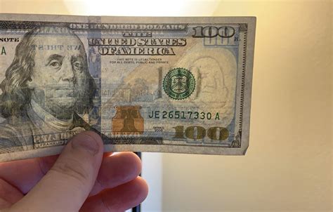 The watermark on the $100 bill looks like Curly from The Three Stooges. : r/mildlyinteresting