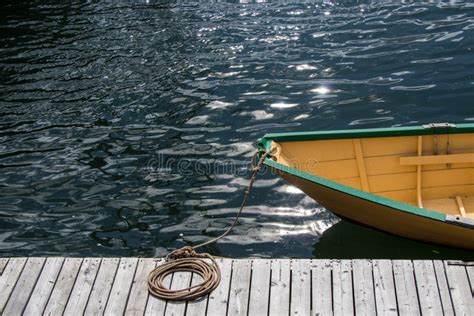 Small Wooden Boat Tied To the Dock Stock Image - Image of nature, warf: 167810103