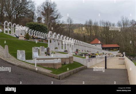 Aberfan disaster. South Wales. Aberfan cemetery with matching white arched headstones for each ...