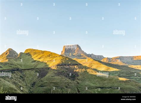 Sunrise on the road to the Sentinel car park in the Drakensberg with the Sentinel in the back ...